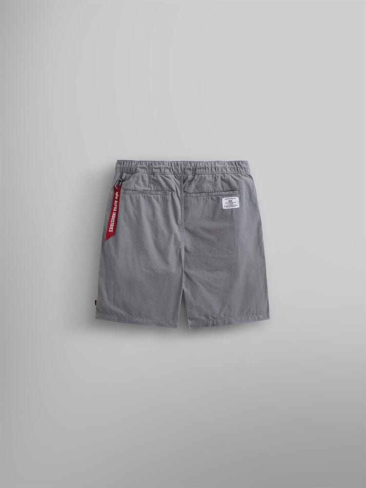 Alpha Industries Deck Shorts: gray shorts with elastic waistband, two back pockets, white label on right pocket, red keychain on left.