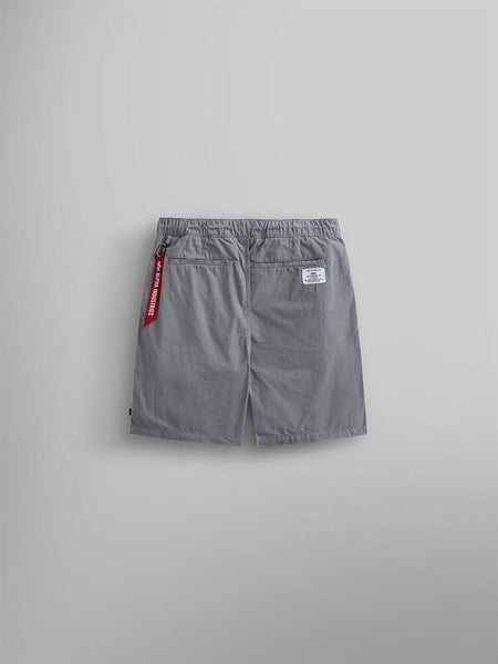 Alpha Industries Deck Shorts: gray shorts with elastic waistband, two back pockets, white label on right pocket, red keychain on left.