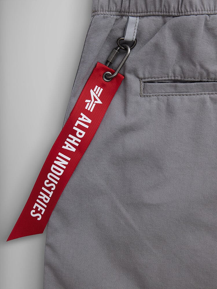 Deck Shorts by Alpha Industries, gray, red brand tag on metal clip, breathable fabric.