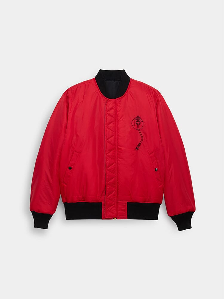 Alpha Industries MA-1 Red Bomber Jacket With Black Cuffs, Waistband, Collar, And Small Black Embroidered Graphic On Left Chest.