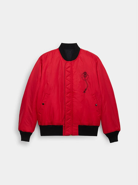 Alpha Industries MA-1 Red Bomber Jacket With Black Cuffs, Waistband, Collar, And Small Black Embroidered Graphic On Left Chest.
