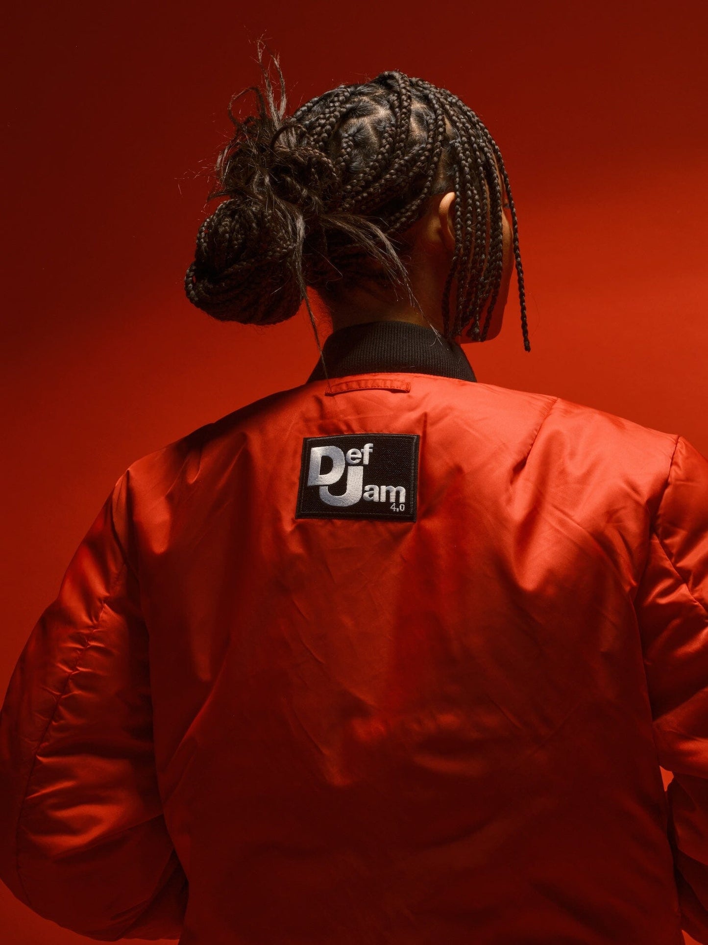 Alpha Industries MA-1 bomber jacket, bright red, black Def Jam logo patch.