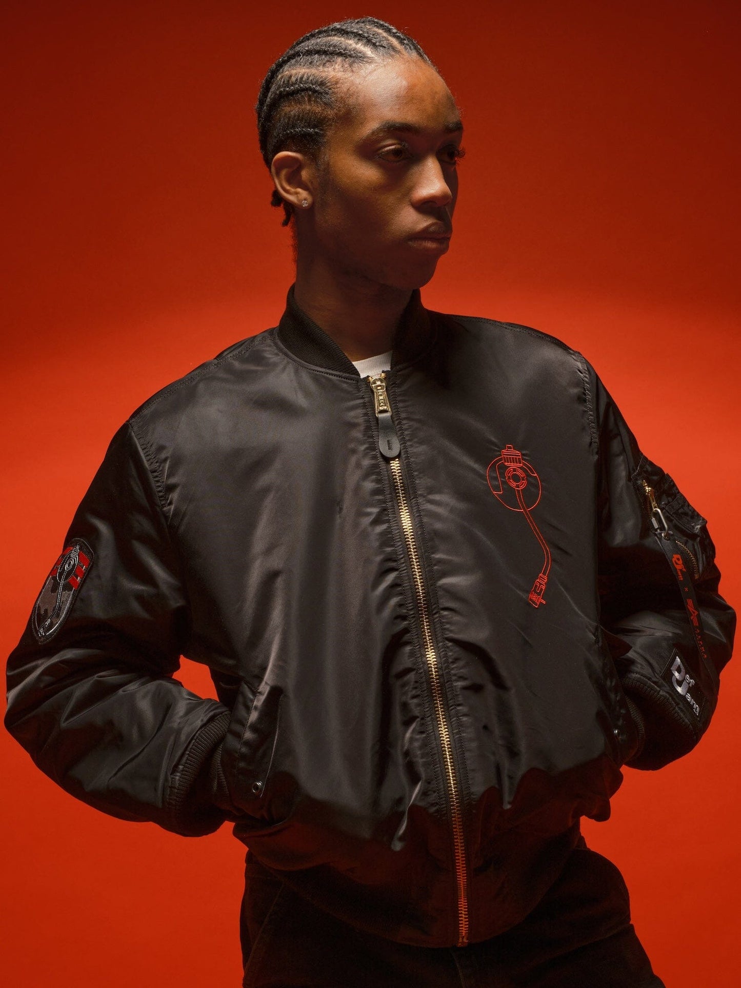Alpha Industries DEF Jam X Alpha MA-1 bomber jacket with red accents.