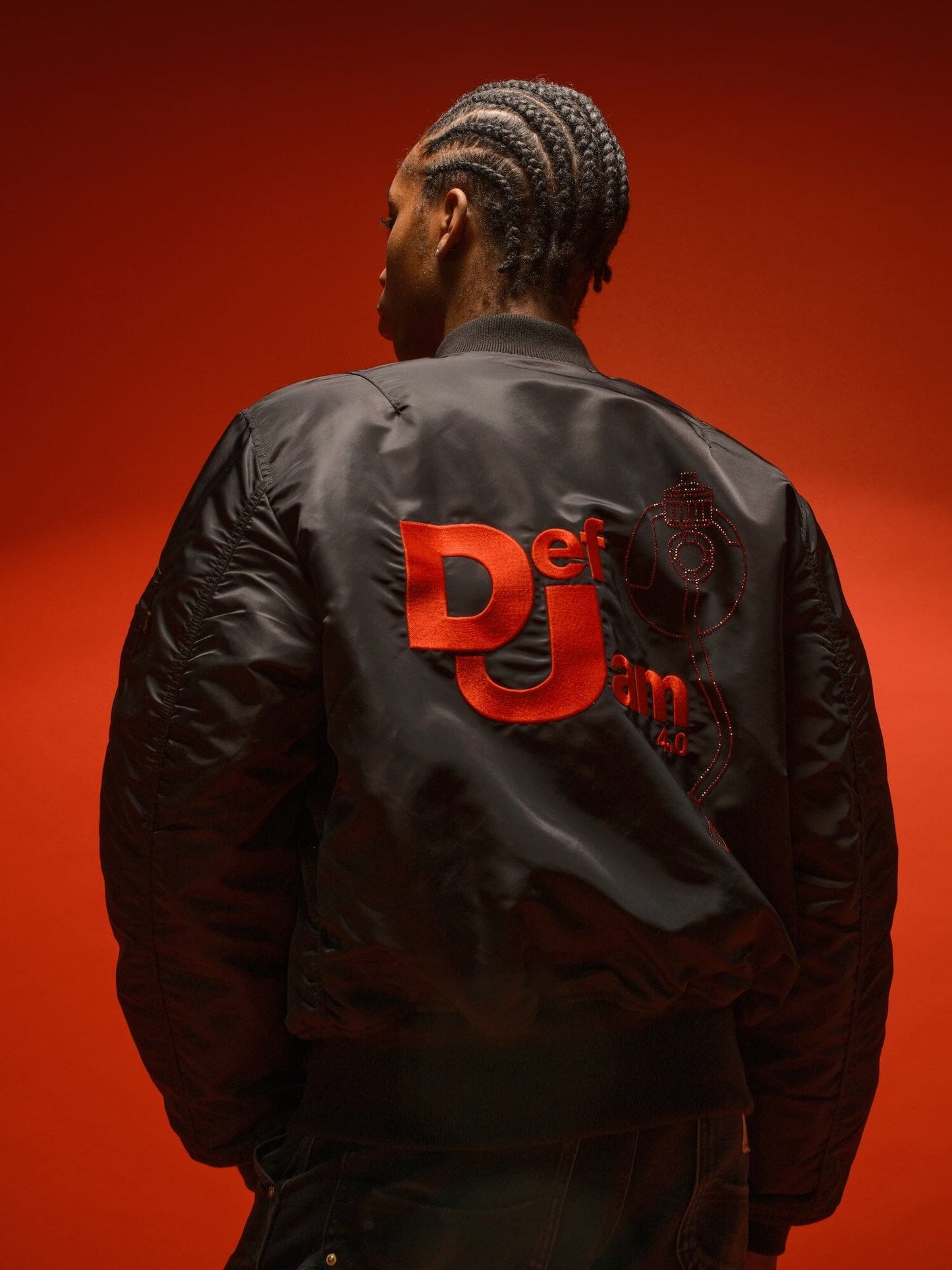 Alpha Industries Def Jam 40th Anniversary X Alpha MA-1 Bomber Jacket, red with orange Def Jam logo on back.