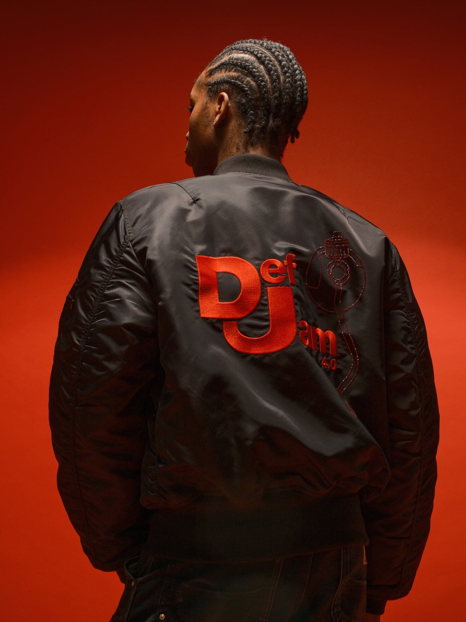 Alpha Industries Def Jam 40th Anniversary X Alpha MA-1 Bomber Jacket, red with orange Def Jam logo on back.