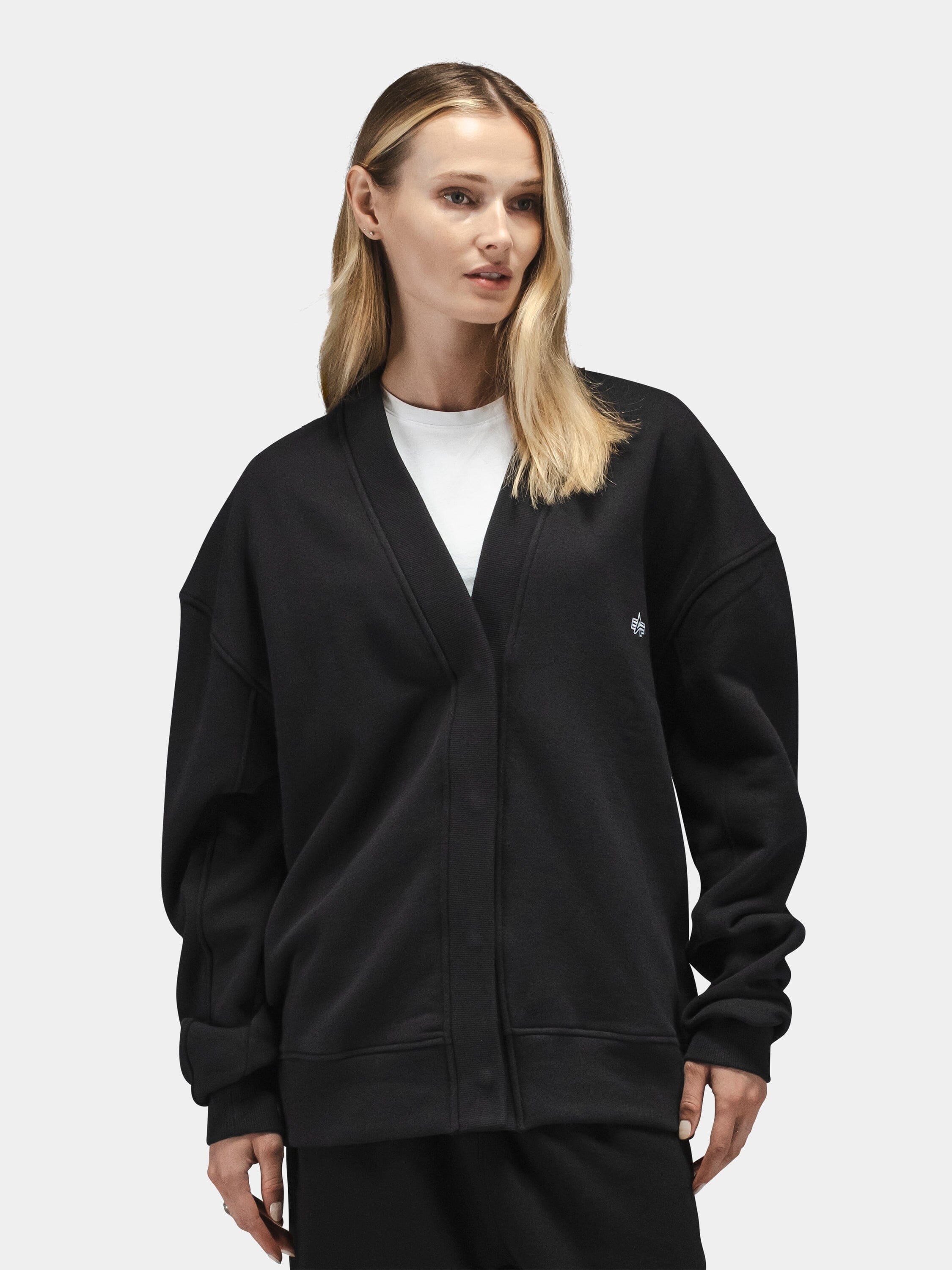 Alpha Industries Essential Cardigan, cotton-poly blend, layered over white shirt.