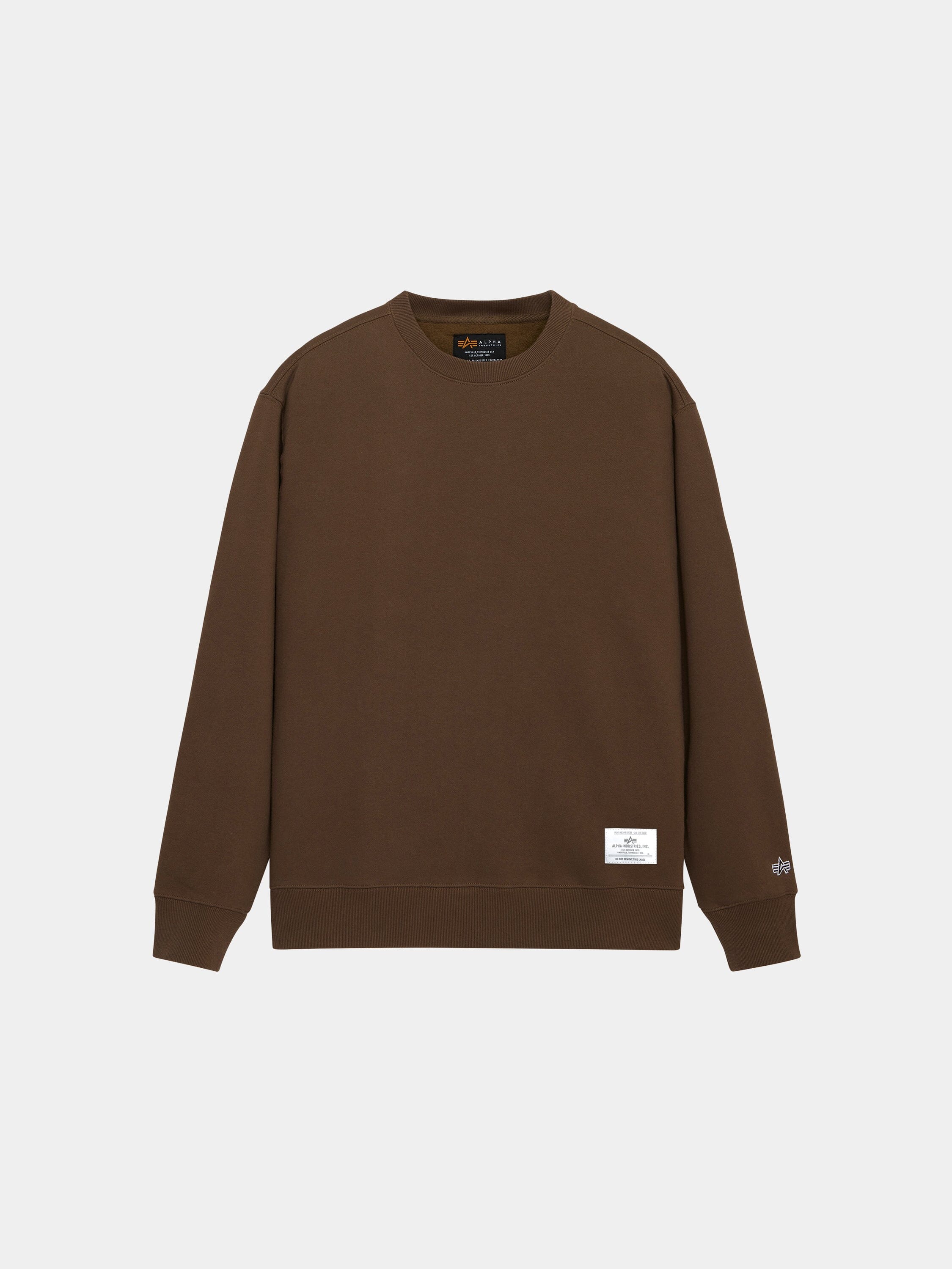 Alpha Industries Essential Crewneck in Espresso with long sleeves, ribbed cuffs and hem, logo on left sleeve, white tag near hem.