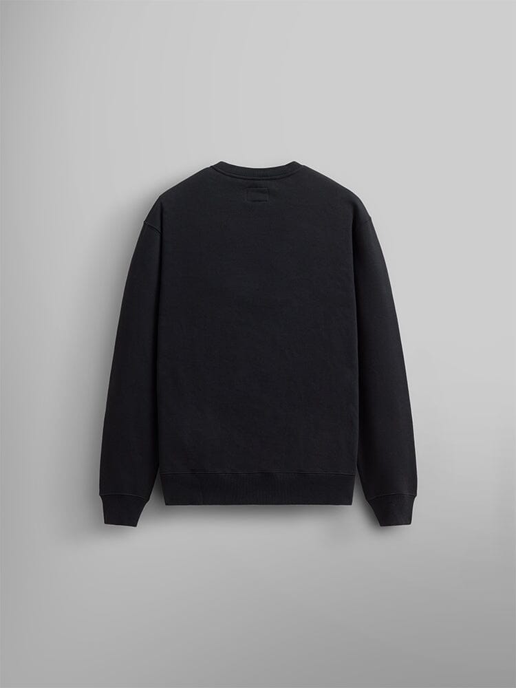 The Essential Crewneck by Alpha Industries is a unisex black sweatshirt crafted from a cotton blend. It is laid flat to highlight its long sleeves and back view.