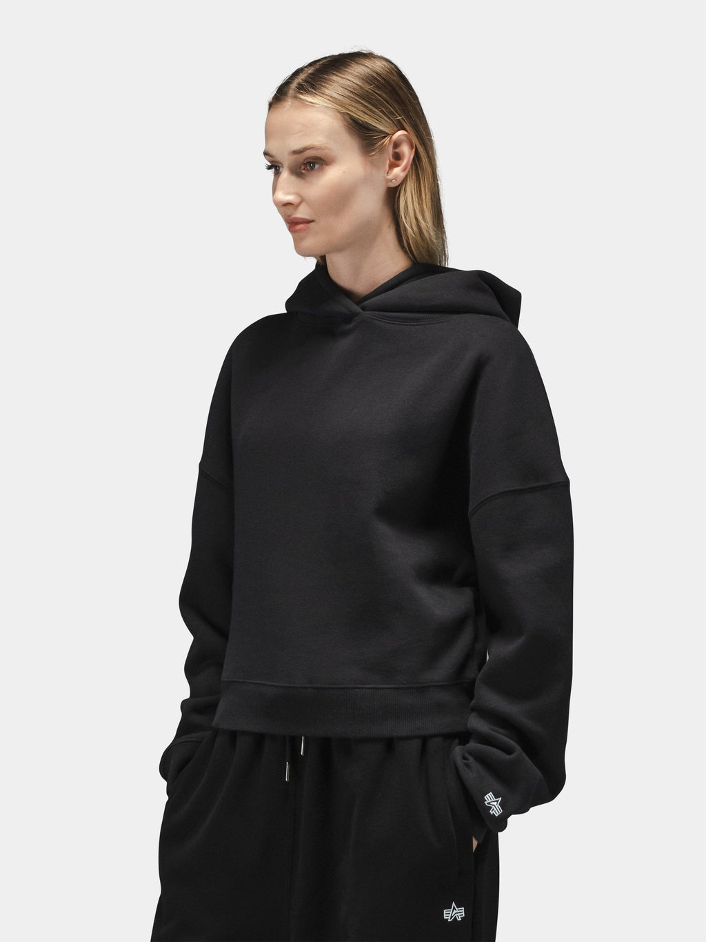 Alpha Industries Essential Cropped Hoodie Womens in black with matching pants; cotton blend, cropped fit, ribbed cuffs and hem.