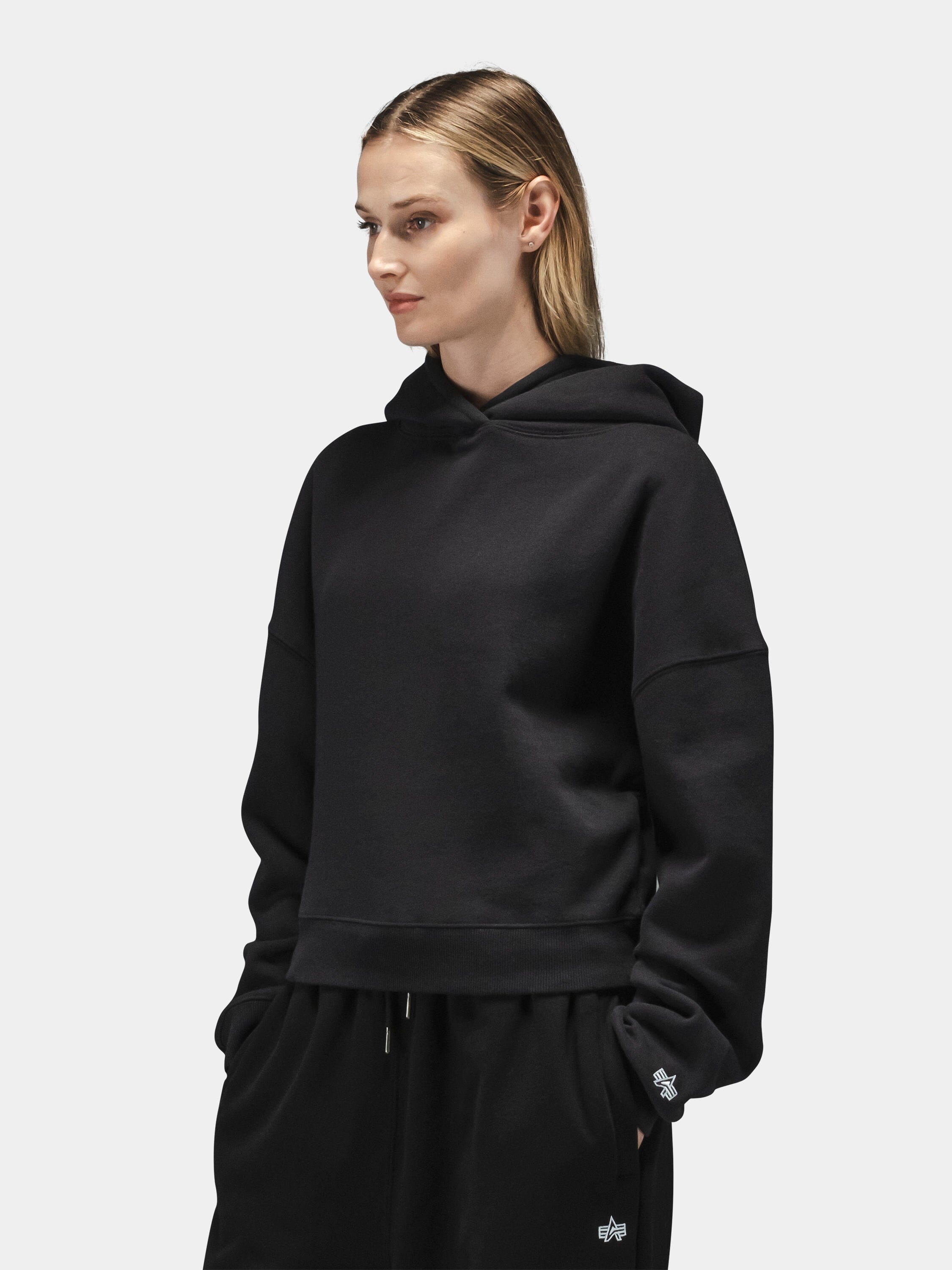 Alpha Industries Essential Cropped Hoodie Womens in black with matching pants; cotton blend, cropped fit, ribbed cuffs and hem.