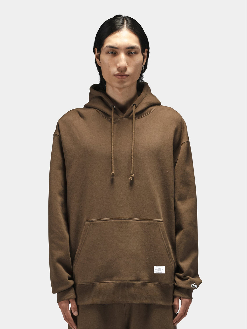 Alpha Industries Essential Hoodie in brown with front pocket and drawstrings.