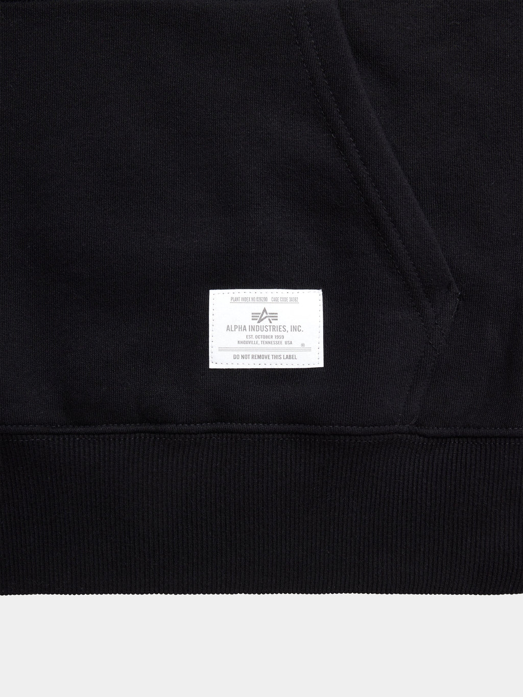 Black Alpha Industries Essential Hoodie with kangaroo pocket and white Alpha Industries label near the hem.