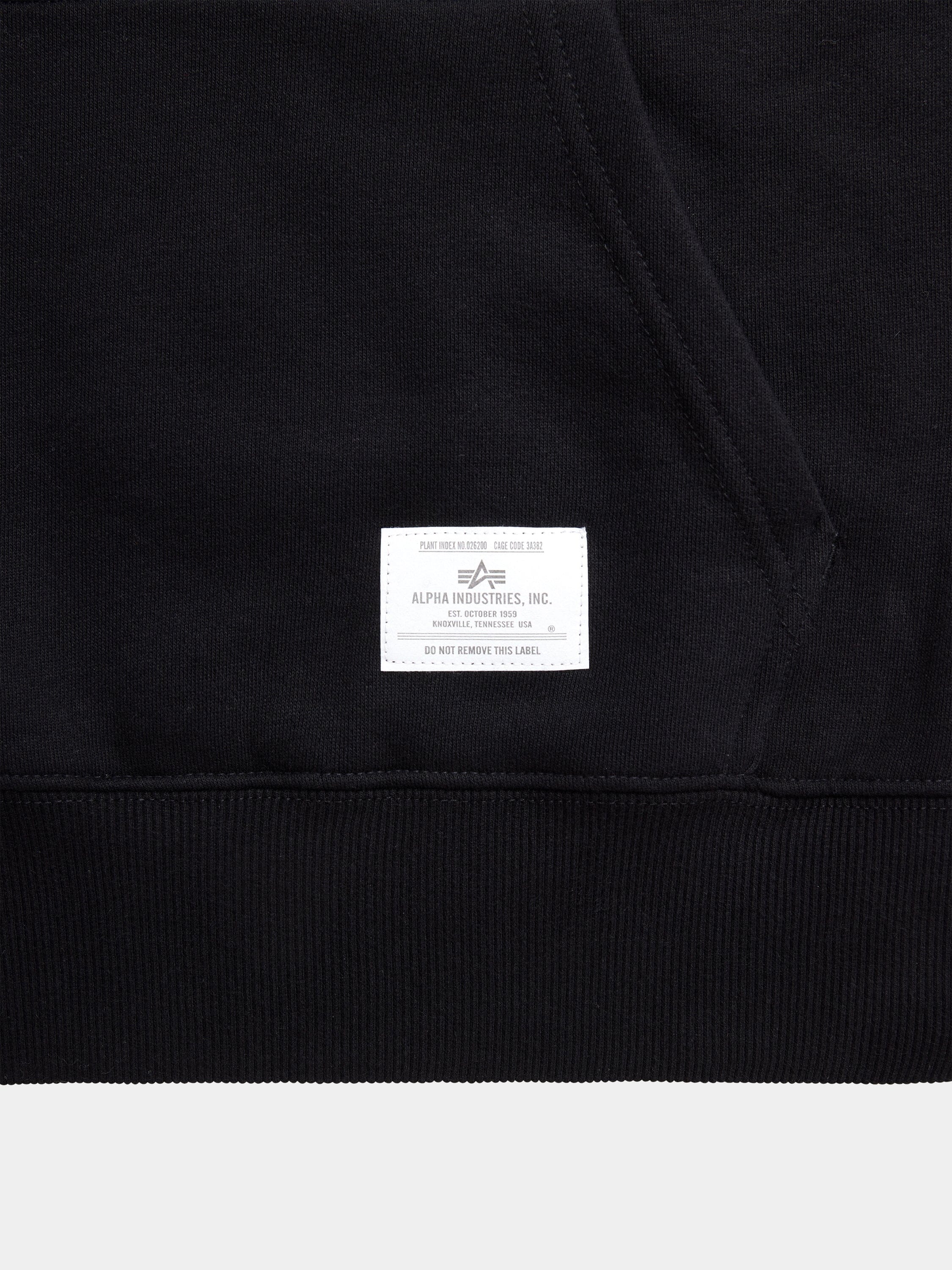 Black Alpha Industries Essential Hoodie with kangaroo pocket and white Alpha Industries label near the hem.