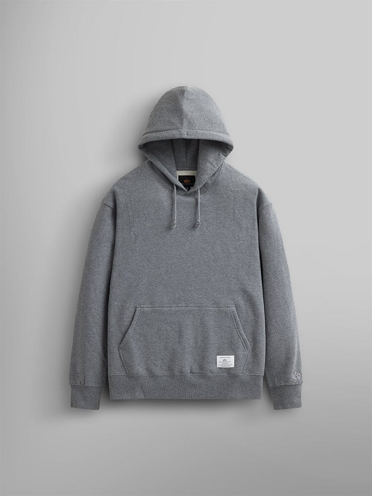 The Essential Hoodie in medium charcoal heather by Alpha Industries showcases its versatility as a wardrobe essential with its front pocket and drawstrings.