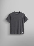 Alpha Industries Essential Relaxed Tee in Dark Charcoal Heather, crew neck, 210 GSM fabric, short sleeves, white label near hem.