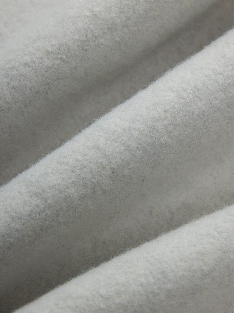 Close-up of soft, light gray cotton fabric with a textured, fuzzy surface from the Women's Essential Sweatpants by Alpha Industries.