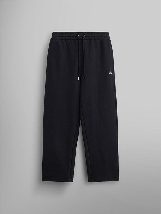 The Women's Essential Sweatpants by Alpha Industries are black and crafted from soft cotton. They come with an elastic waistband and a small embroidered logo on the upper left.