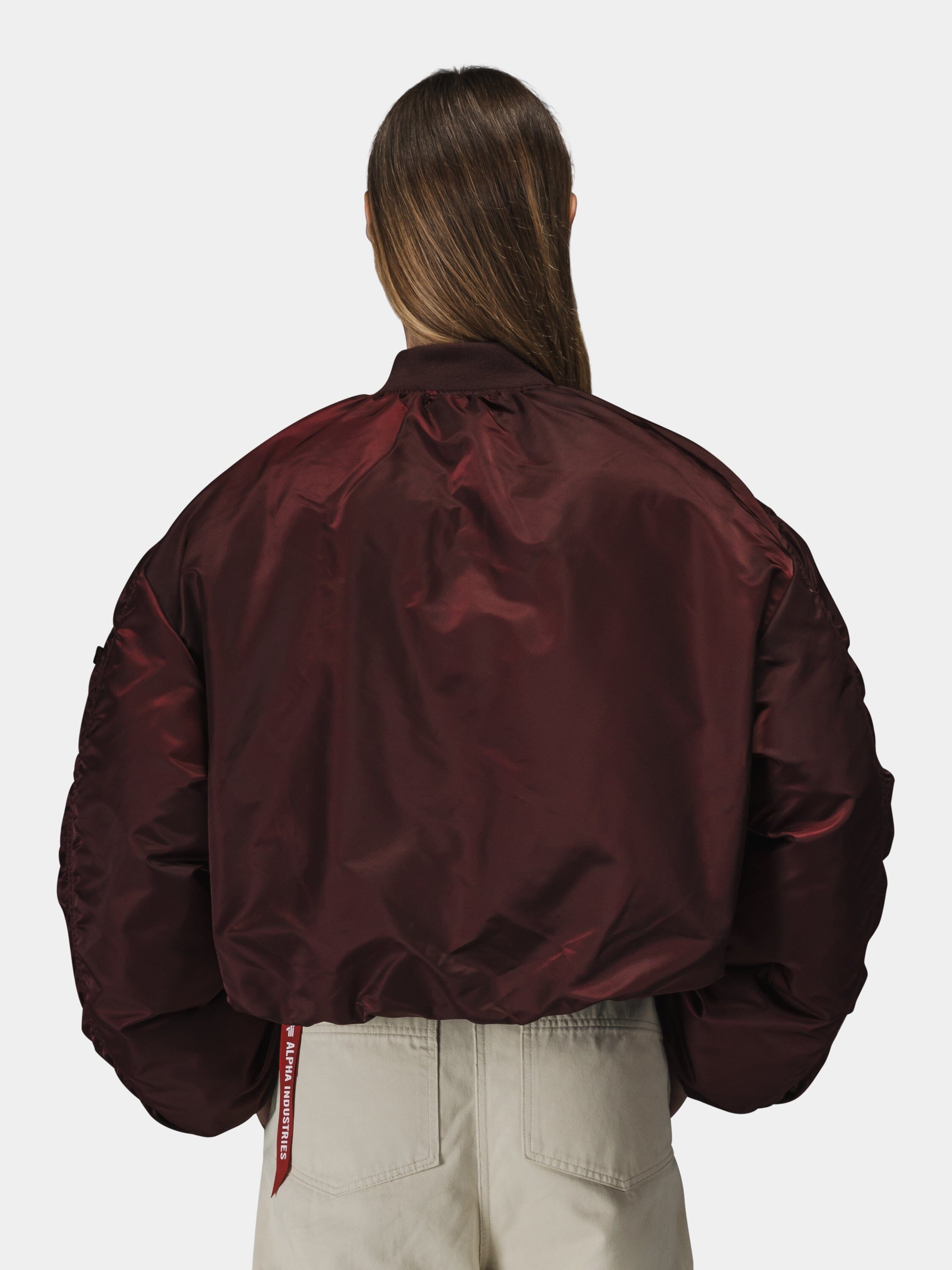Alpha Industries Knit Rib MA-1 Flight Jacket Womens in shiny burgundy with knit rib cuffs and hem, zip closure.