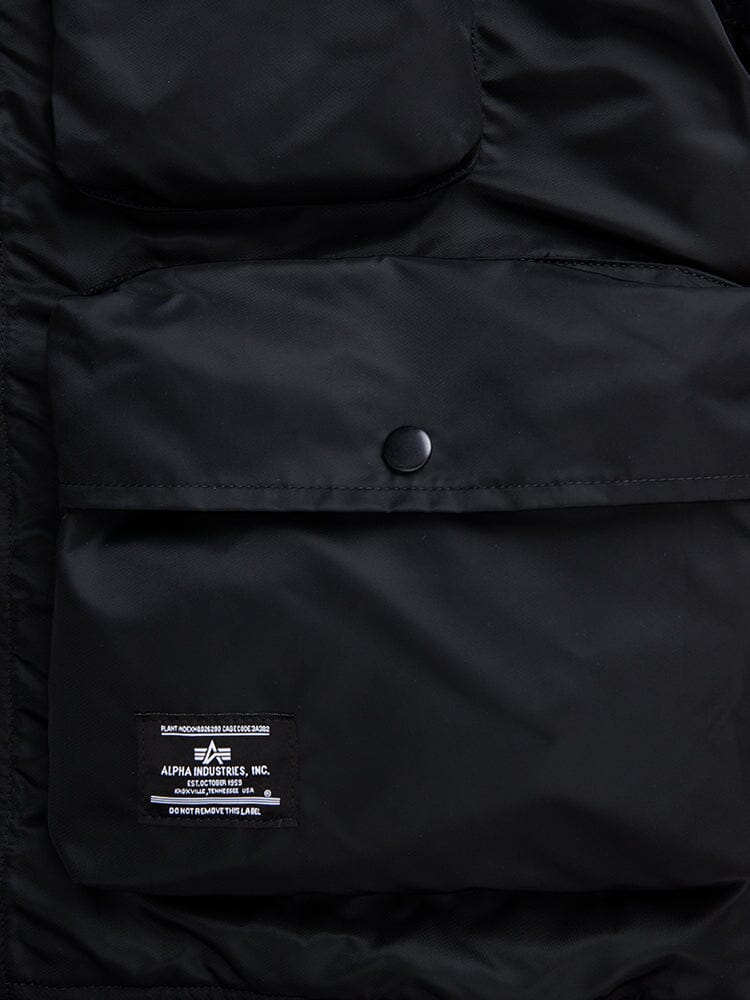 L-2B Short Sleeve Bomber Jacket by Alpha Industries, black water-resistant nylon, utility pocket with snap button, brand label.
