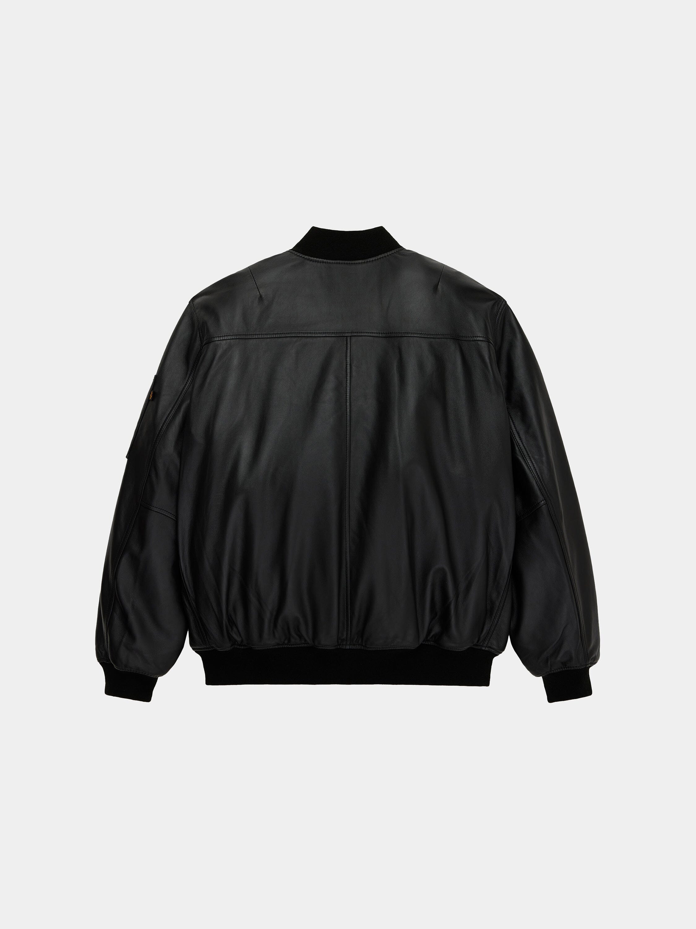 Alpha Industries Leather MA-1 Flight Jacket in black with ribbed cuffs, collar, and hem.
