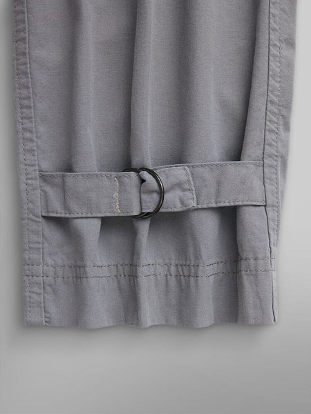 Alpha Industries Lightweight Trouser W in Grey; Garment-Washed Cotton, Stitched Hem, Adjustable Strap with Metal D-Ring Buckle at Cuff.