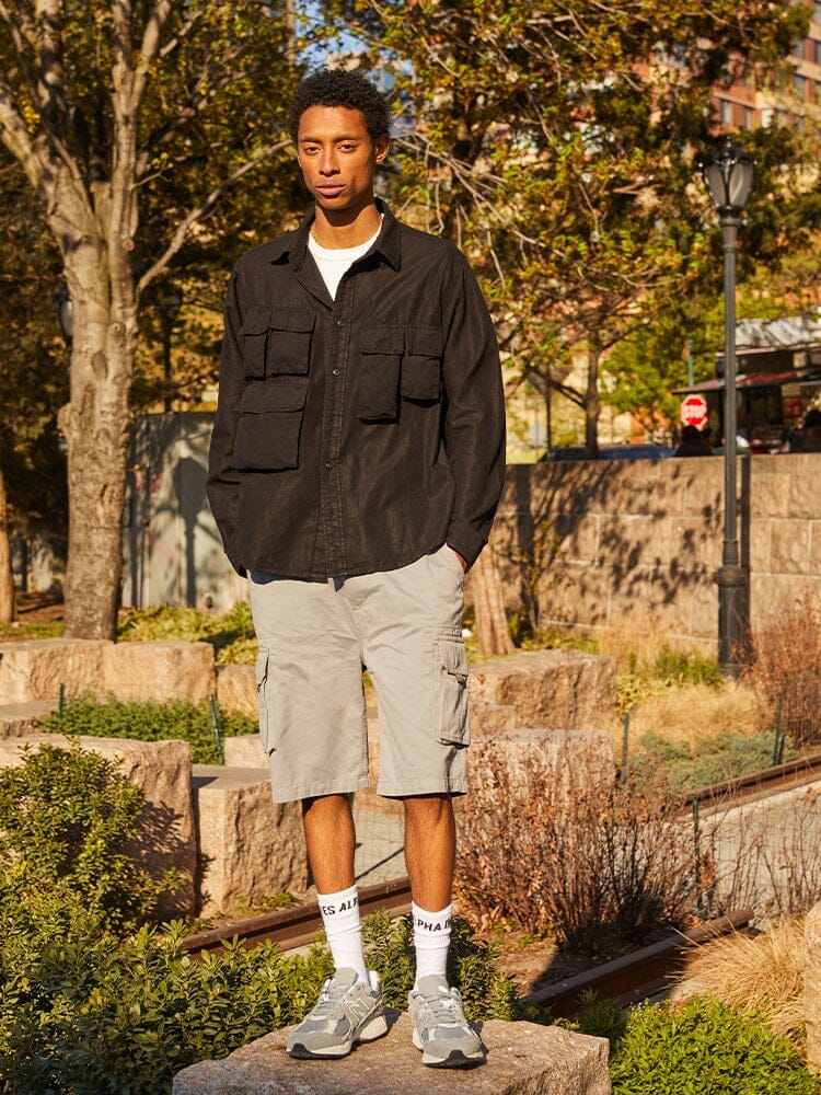 Alpha Industries Long Sleeve Multi Pocket Shirt Black, featuring multiple pockets and button closures.