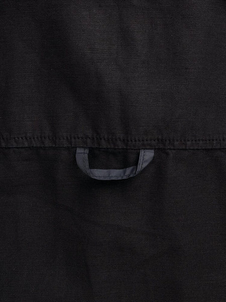Alpha Industries Long Sleeve Multi Pocket Shirt, black, with small horizontal loop stitched near center of fabric.