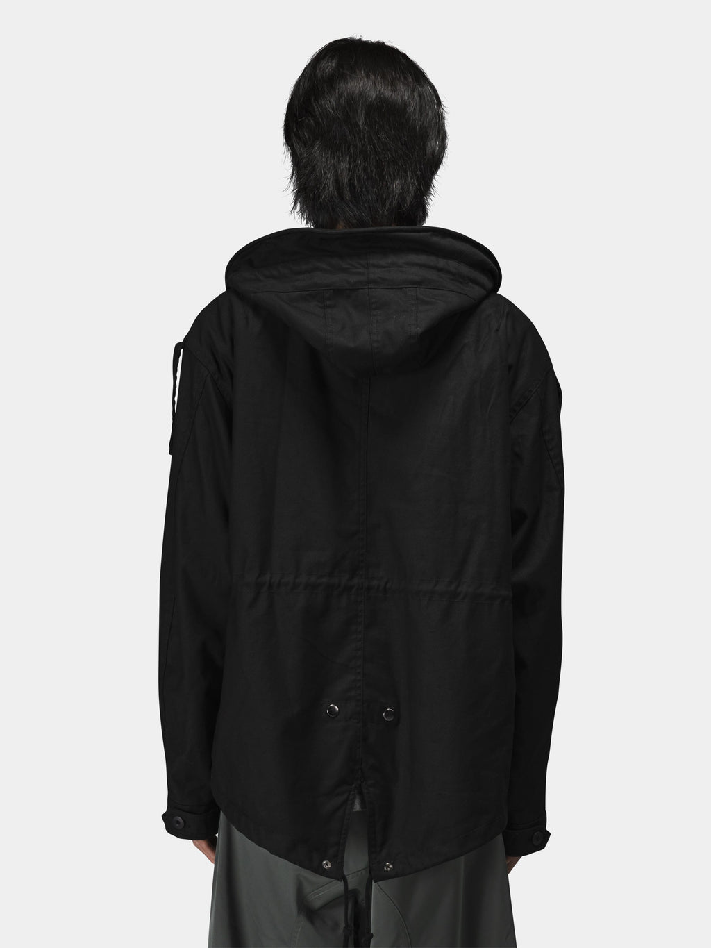 Alpha Industries M-65 Mod Fishtail Field Coat, black parka with loose fit and drawstring waist.