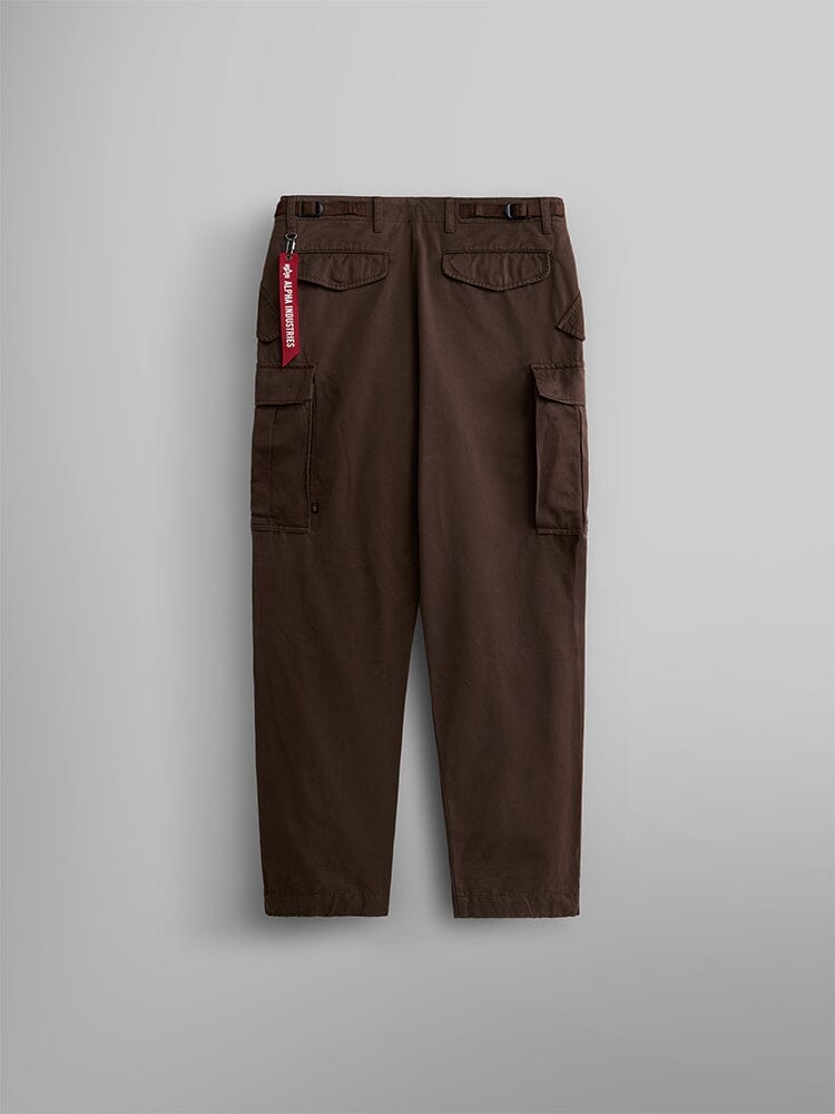 Alpha Industries M-65 Pant, brown cargo pant with utility pockets, red keychain tag on belt loop.