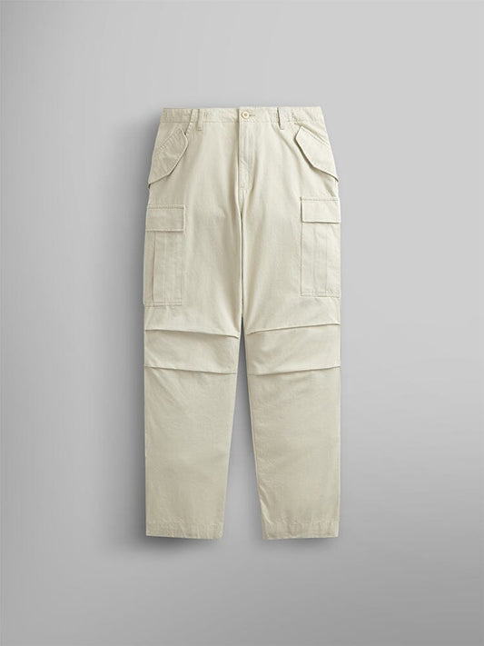 Alpha Industries M-65 Pant in Limestone, with utility pockets and visible seam details.