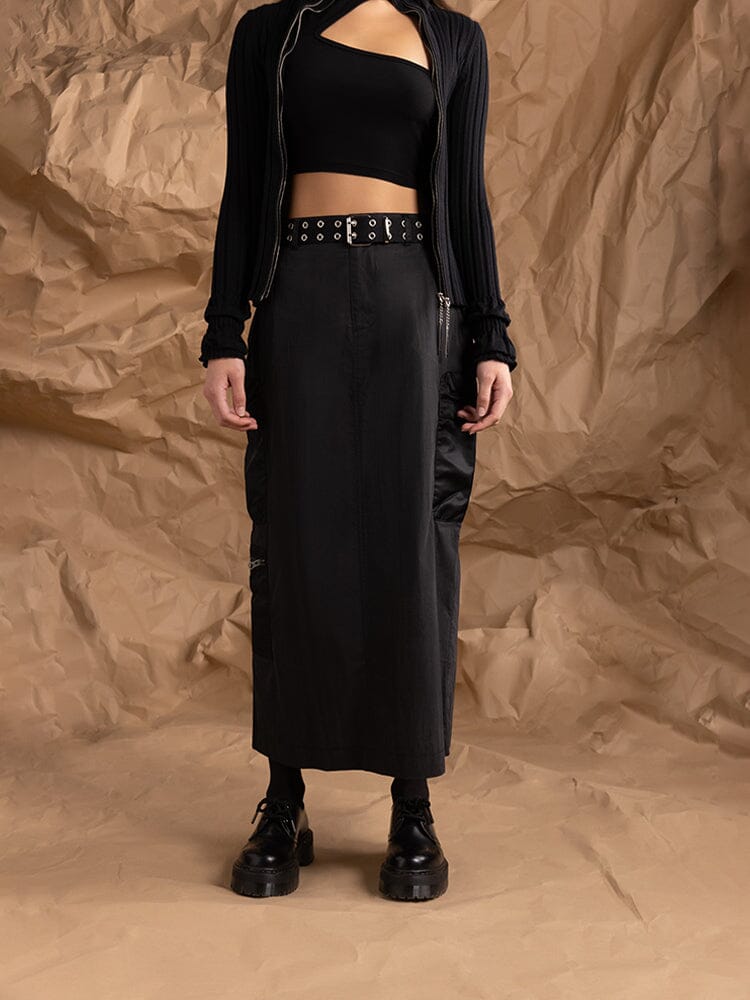 A person in a black crop top wearing the Women's M-65 Skirt in black from Alpha Industries.