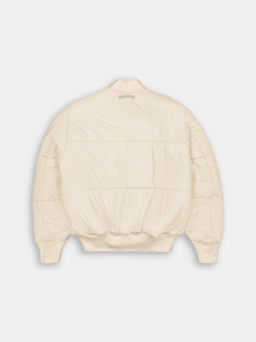 Alpha Industries MA-1 3M Flight Jacket in cream, puffer-style bomber with ribbed cuffs, hem, and collar, crafted from premium materials and military-inspired design.