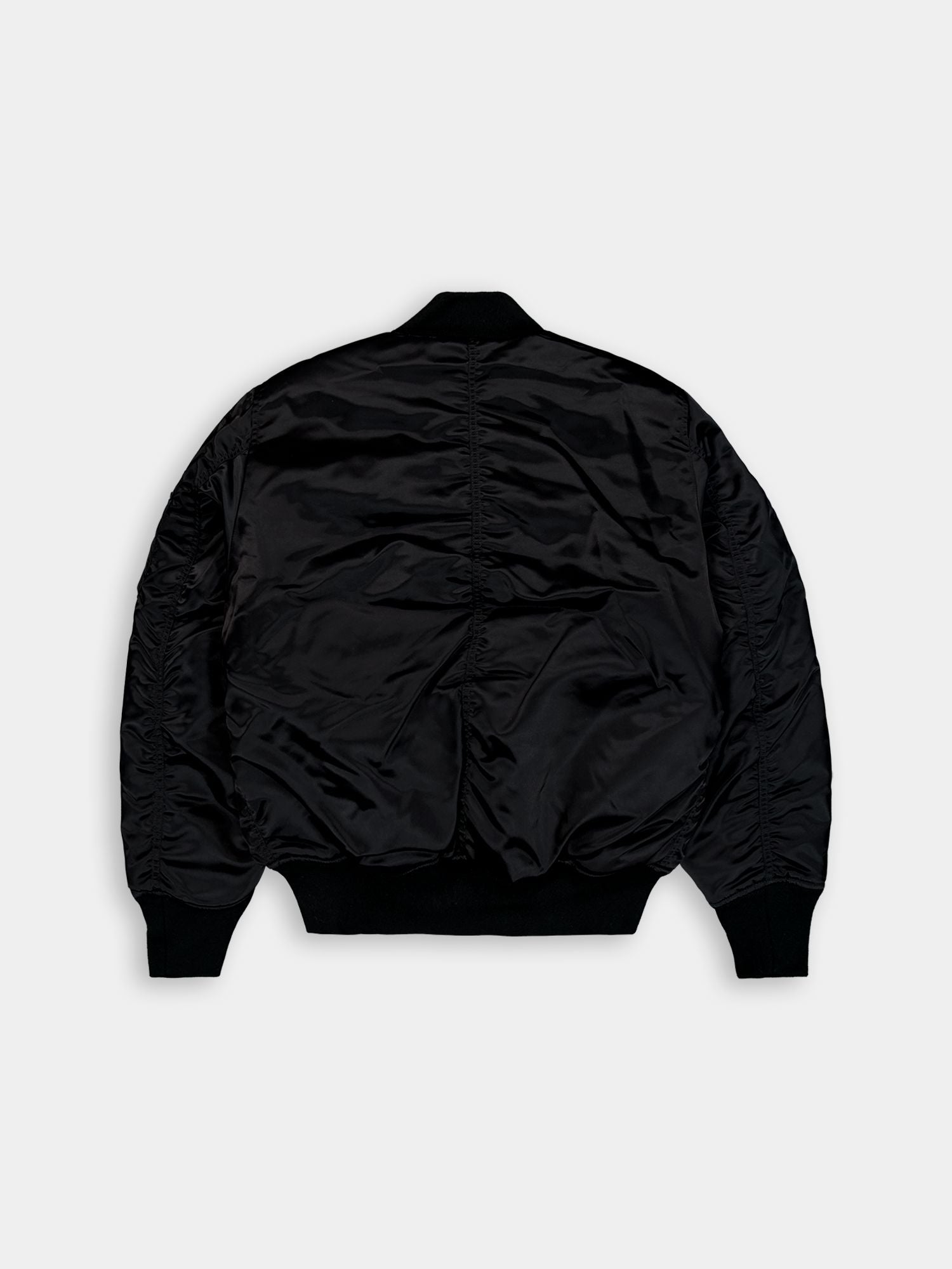 Alpha Industries MA-1 3M Base Flight Jacket in black, ribbed collar, cuffs, and hem.