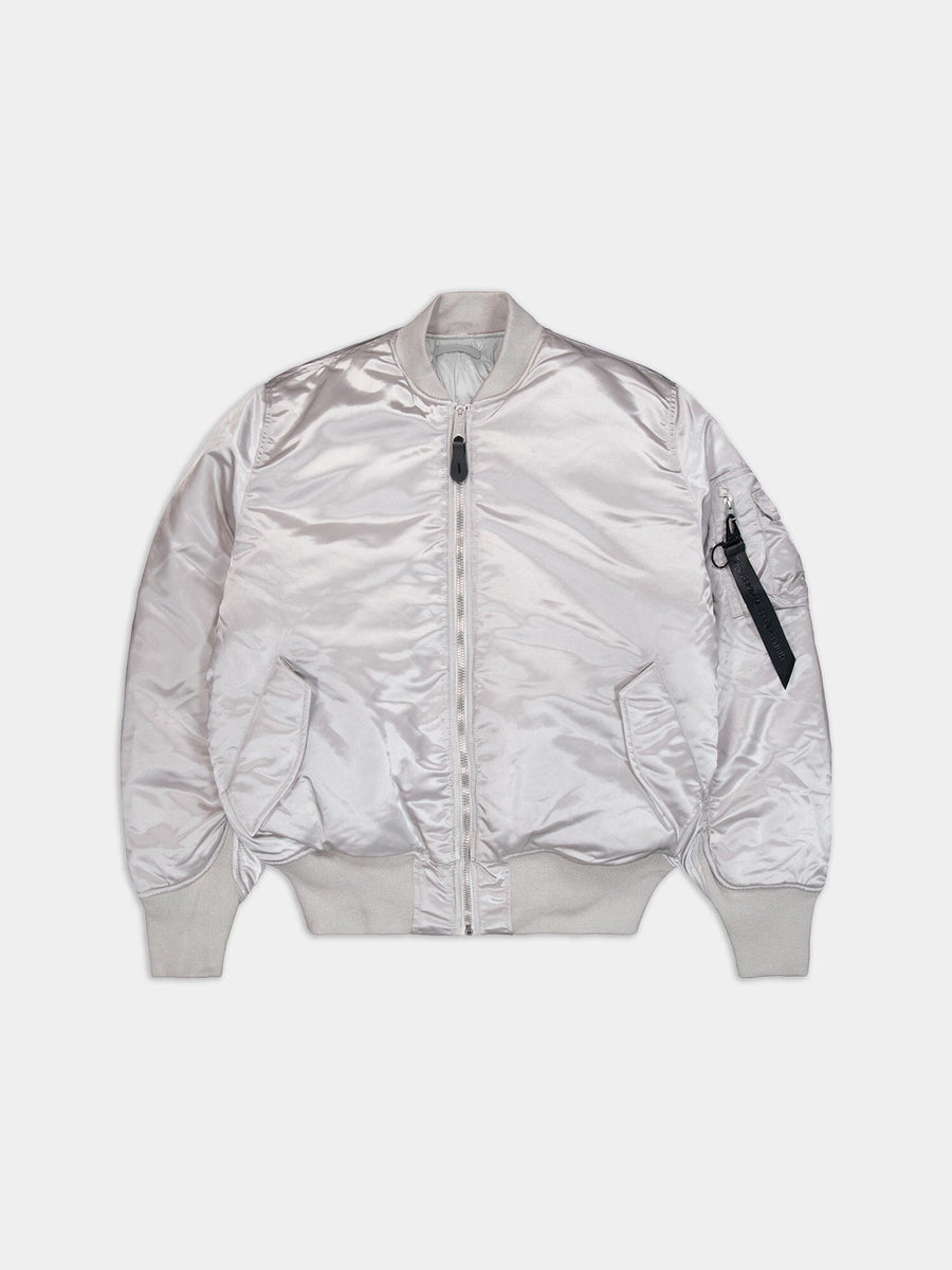 Alpha Industries MA-1 3M Flight Jacket, pastel gray, ribbed cuffs and hem, side pockets, front zipper, zippered sleeve pocket with black pull tab.