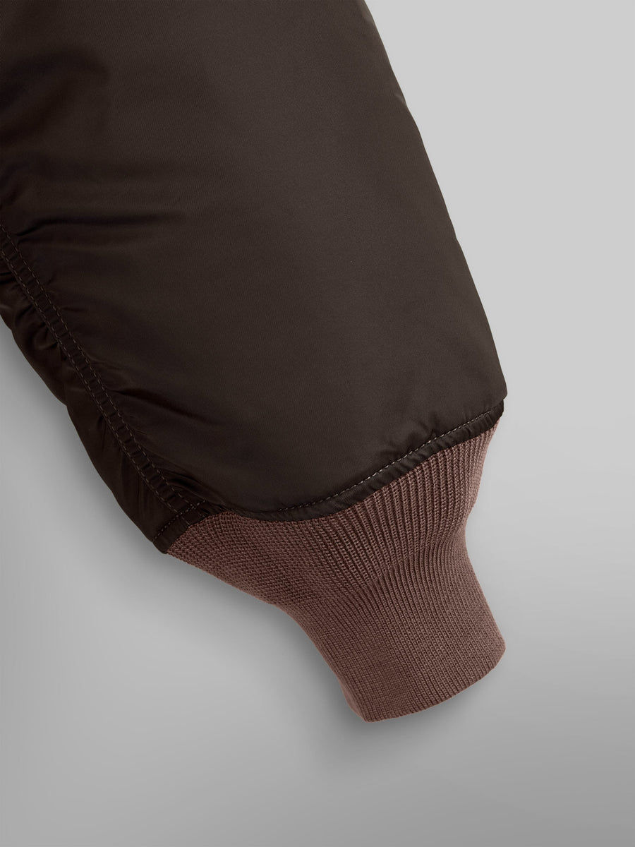 Alpha Industries MA-1 Bomber Jacket Chocolate, dark brown sleeve with ribbed light brown knit cuff.