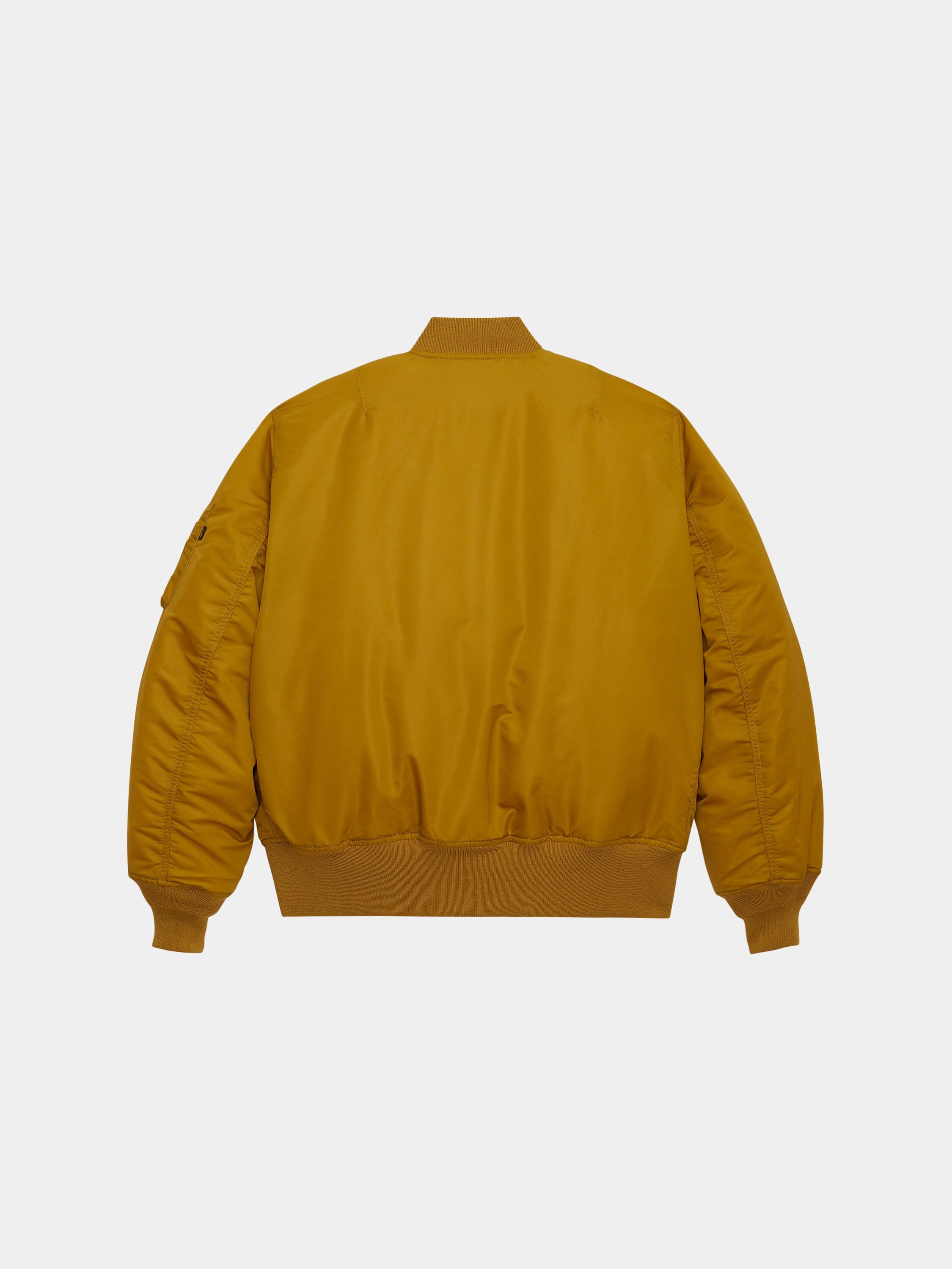 Mustard yellow Alpha Industries MA-1 bomber jacket with ribbed cuffs, collar, and waistband.