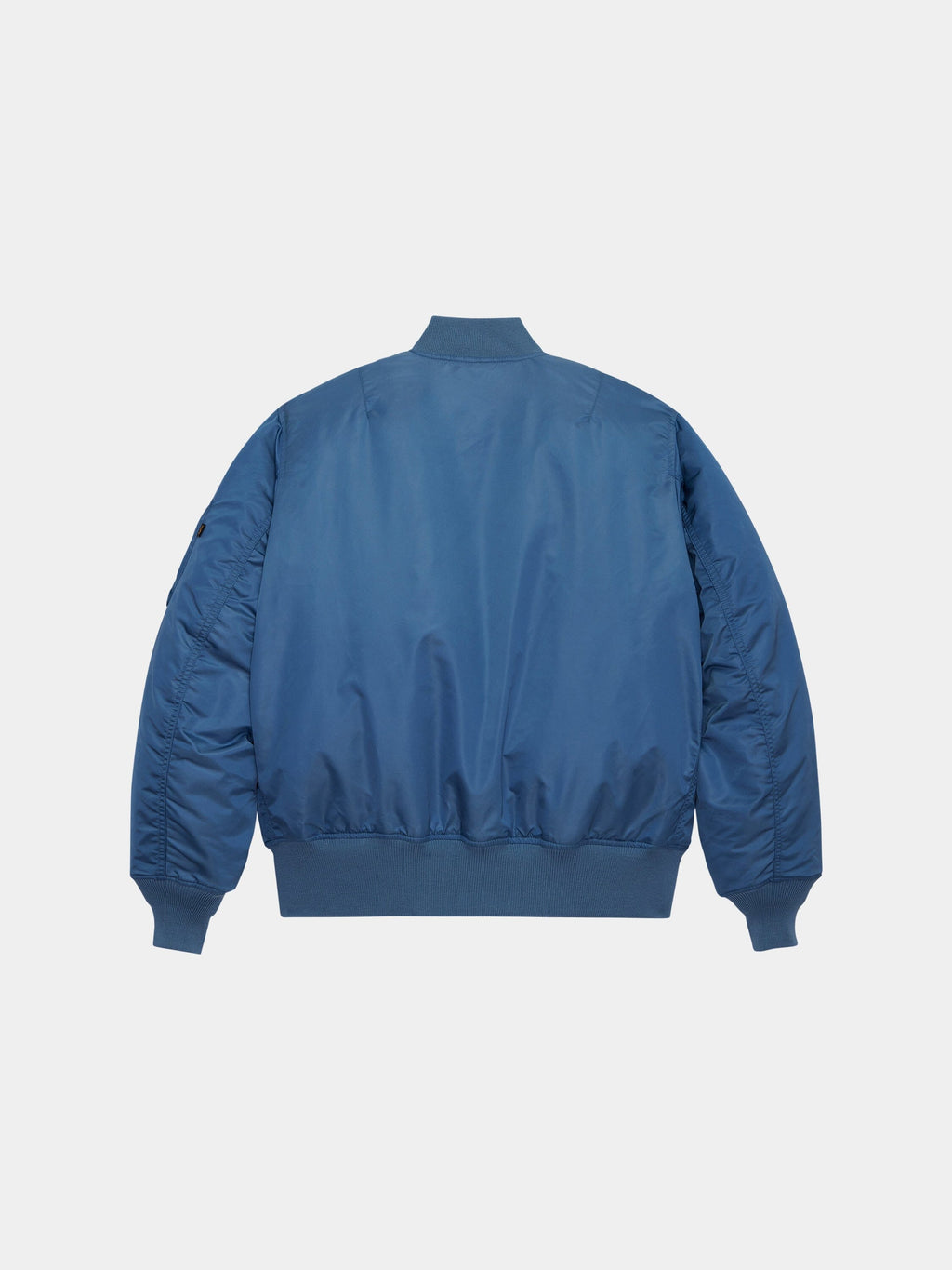 Alpha Industries MA-1 Bomber Jacket in blue with ribbed cuffs, waistband, and collar.