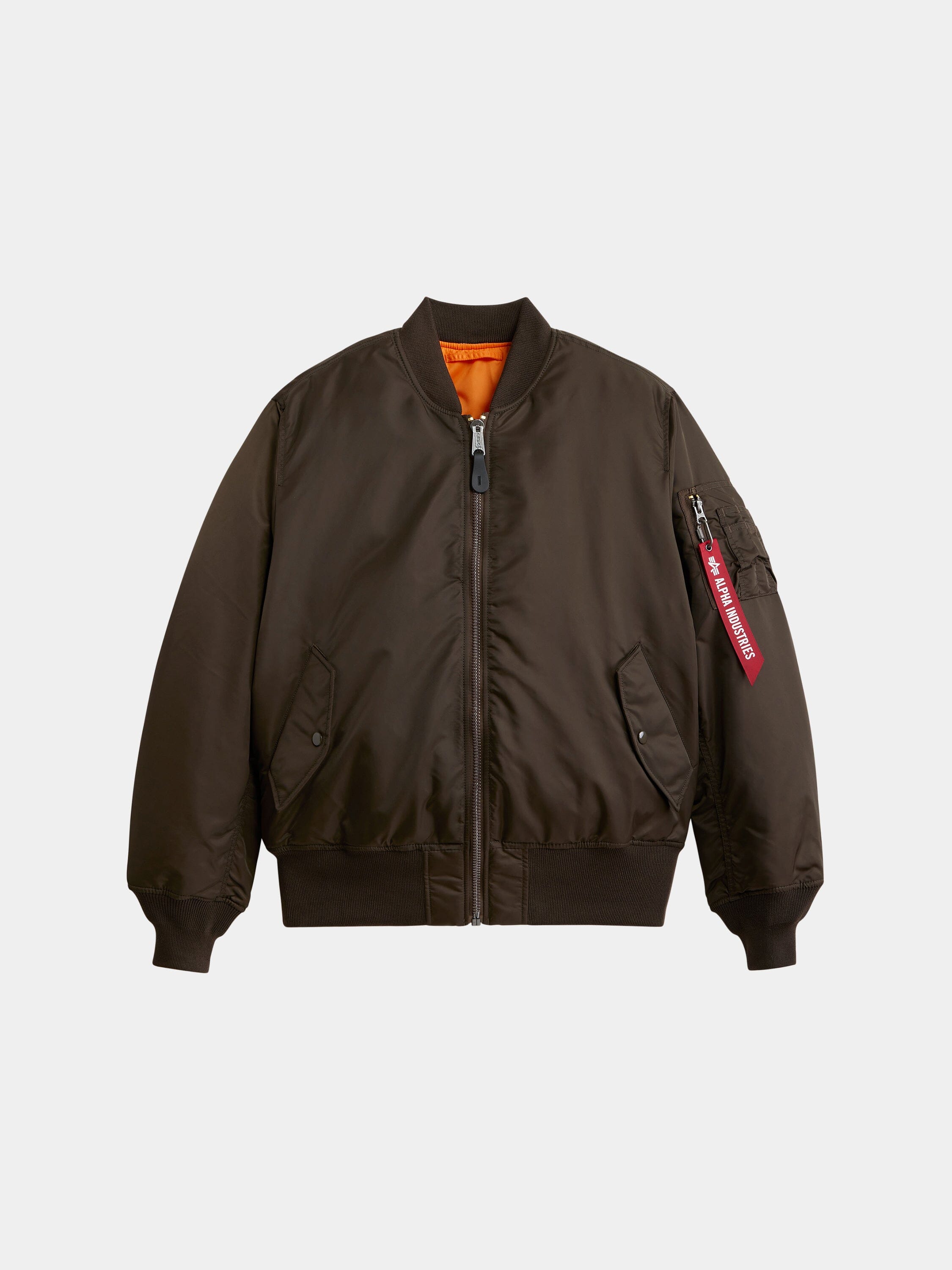 MA-1 Bomber Jacket by Alpha Industries in espresso with front zipper, ribbed cuffs and hem, orange lining, and red sleeve tag.