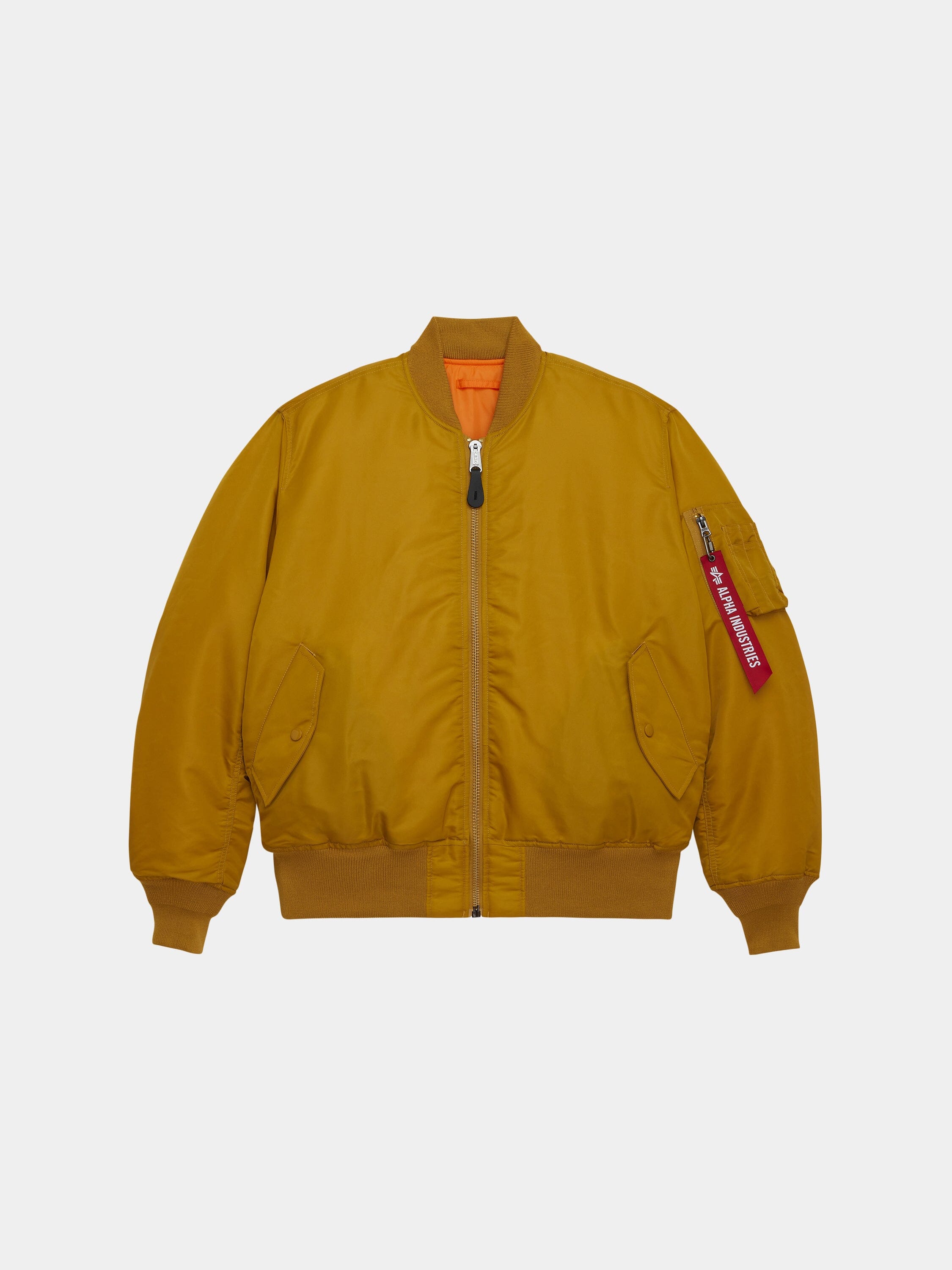 MA-1 Bomber Jacket by Alpha Industries in mustard yellow fabric with front pockets, ribbed cuffs and hem, orange lining, red sleeve tag.