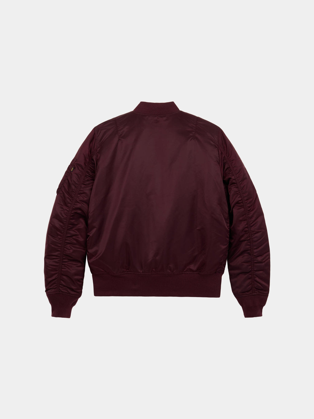 Back flat-lay view of cedar red Alpha Industries MA-1 Bomber Jacket Slim Fit showing ribbed collar, cuffs, and waistband.
