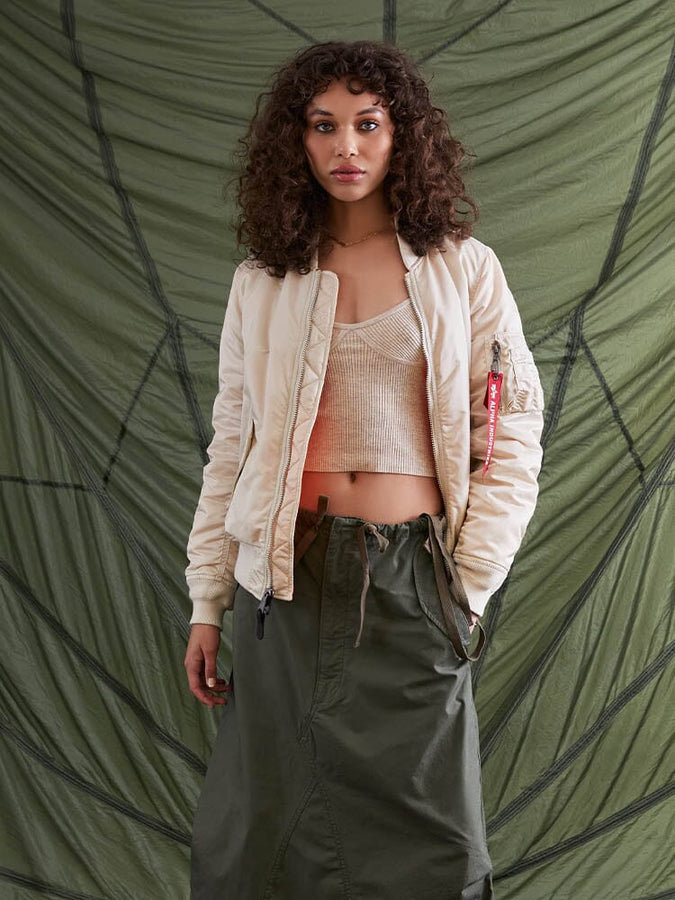Alpha Industries MA-1 Bomber Jacket W in cream, with ribbed collar, front zipper closure, and pocket details.