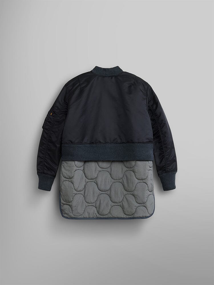 The Women's 3-in-1 MA-1 Quilted Liner by Alpha Industries is showcased from the back, with an onion quilted lower section and finished with ribbed cuffs, collar, and hem.