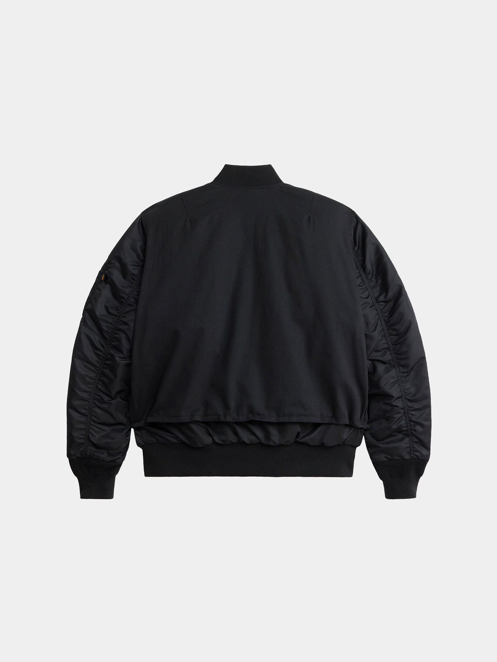 Alpha Industries MA-1 Mixed Cotton Flight Jacket with ribbed cuffs, waistband, collar, and smooth fabric on sleeves and body.