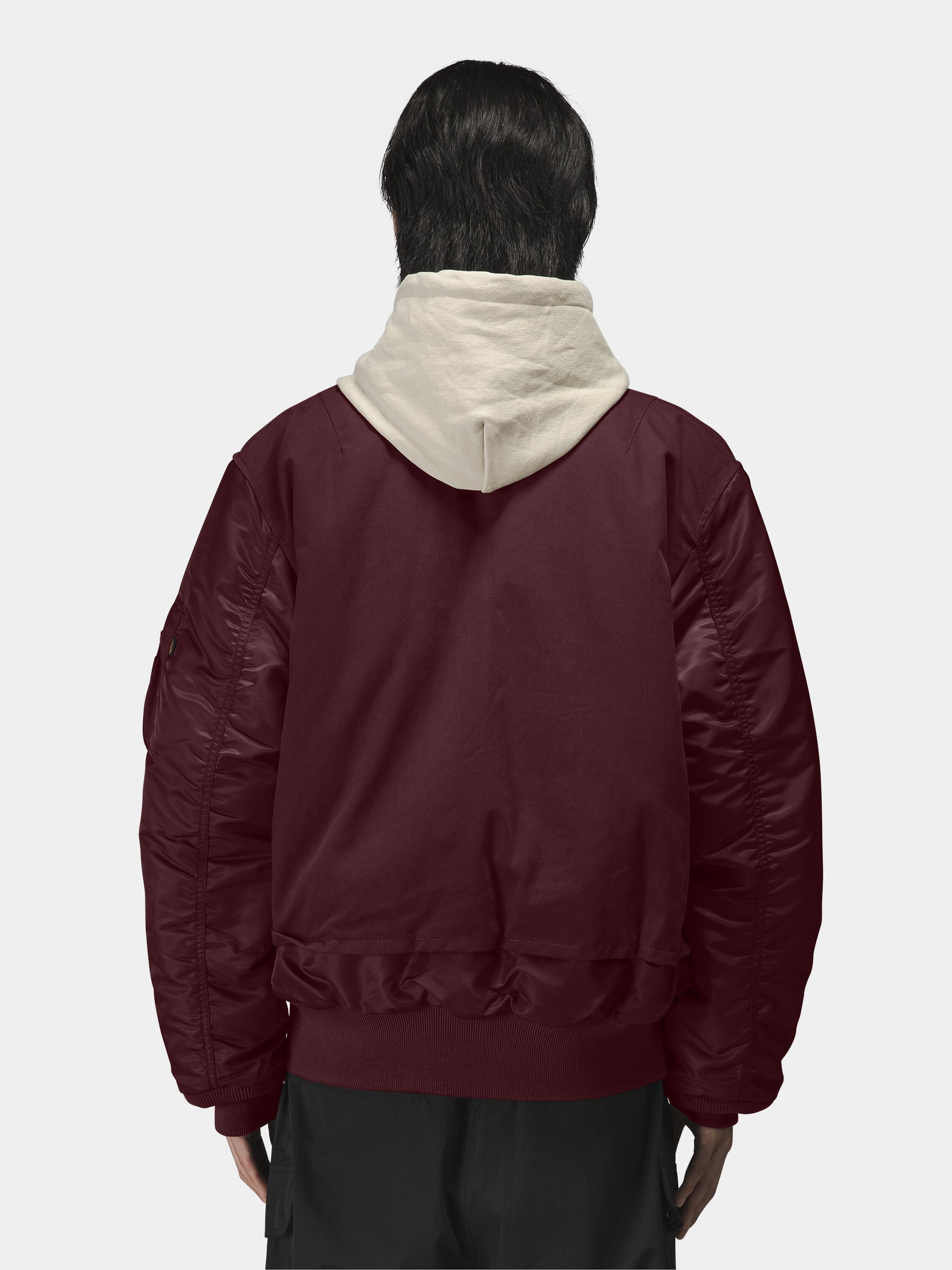 Alpha Industries MA-1 Mixed Cotton Flight Jacket in burgundy over a light beige hoodie.