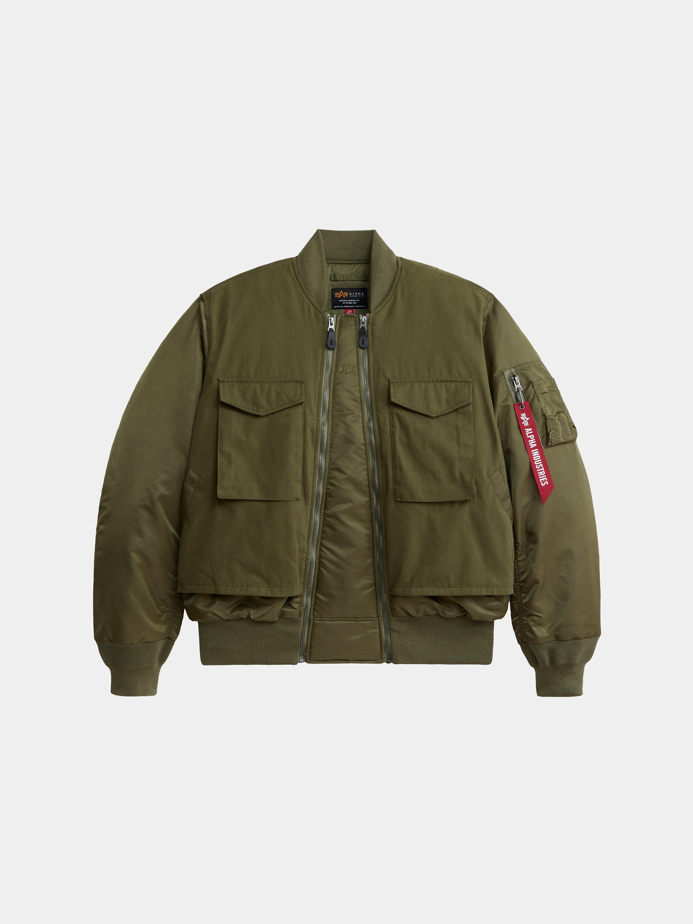 Alpha Industries MA-1 Mixed Cotton Flight Jacket in Og-107 Green with two front flap pockets, zip closure, ribbed cuffs and hem, red tag on sleeve zipper.