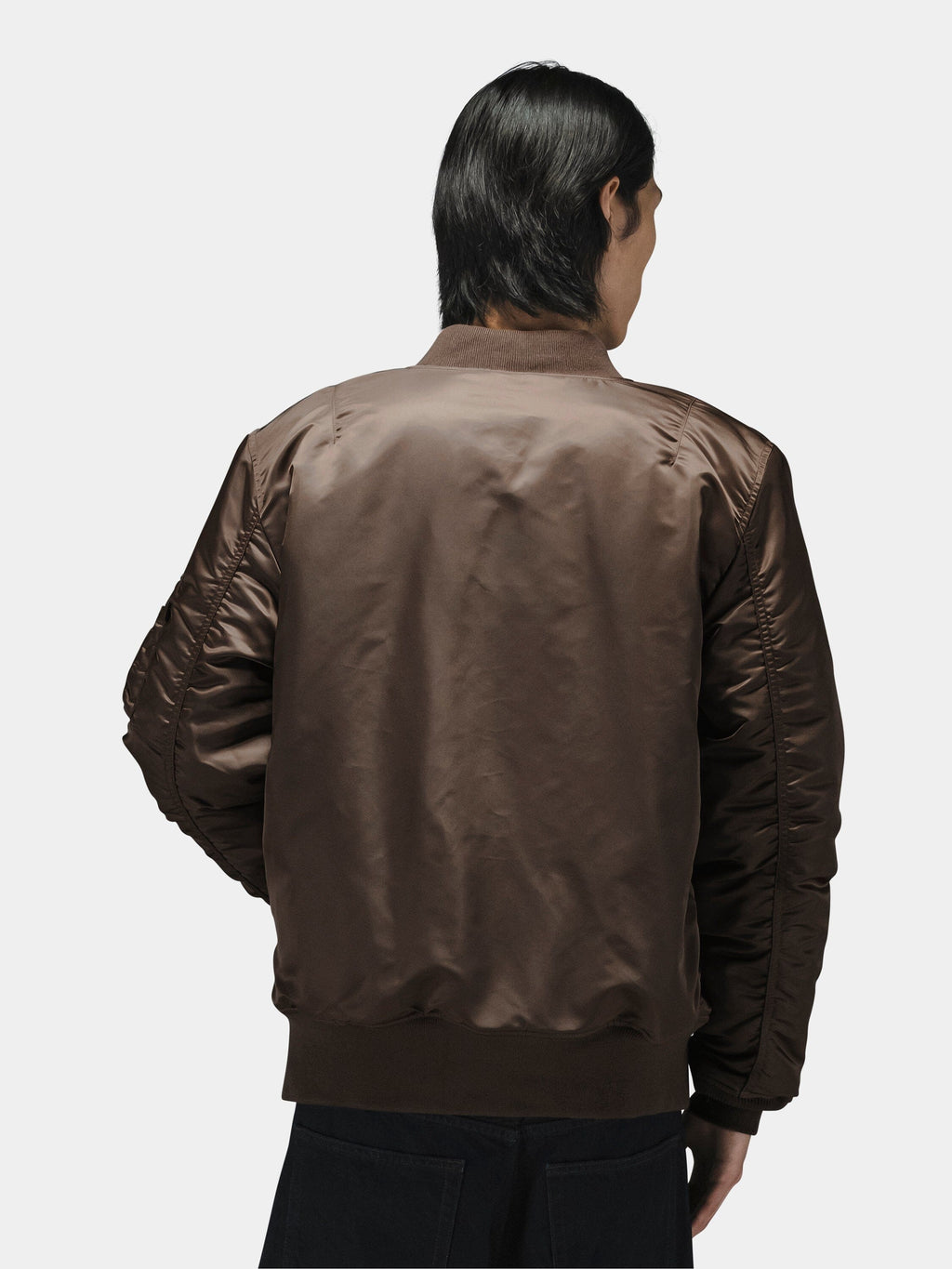 Alpha Industries MA-1 Mod Bomber Jacket in brown with utility pocket, water-resistant material.