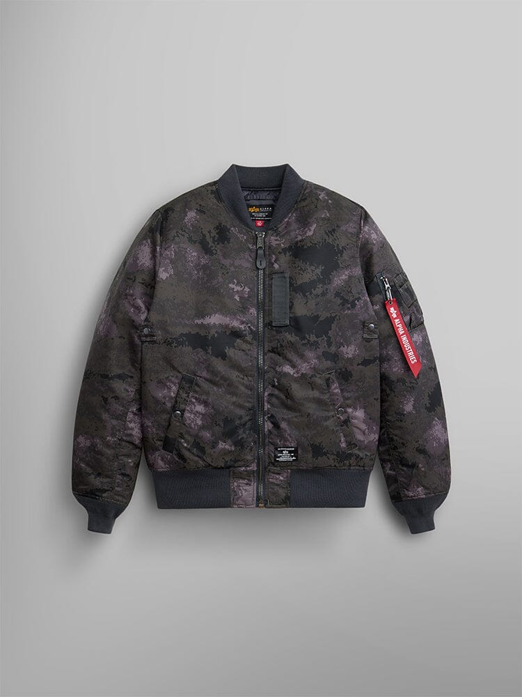 Alpha Industries MA-1 Mod Bomber Jacket with dark camo print, ribbed cuffs and hem, front zipper, water-resistant fabric, sleeve utility pocket, red Remove Before Flight tag.