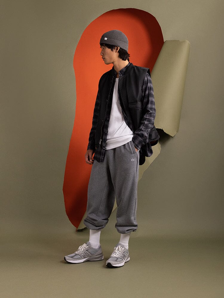 Side view of a person wearing the MA-1 Mod Vest in black by Alpha Industries.