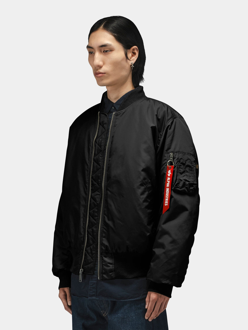 Alpha Industries MA-1 Oxford Flight Jacket in black with red Remove Before Flight sleeve tag.
