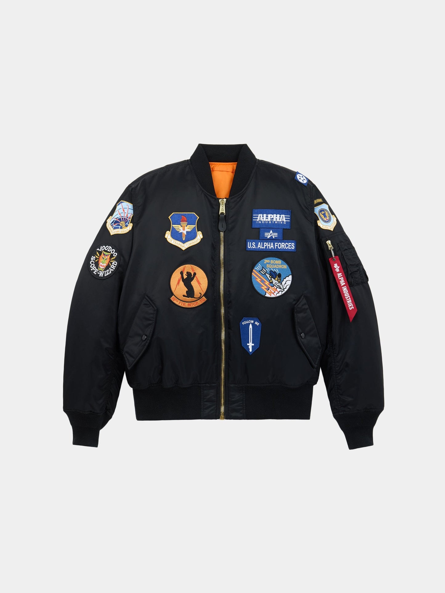 Alpha Industries MA-1 Squadron Bomber Jacket in black with squadron patches and military-style embroidery on front, sleeves, shoulders.